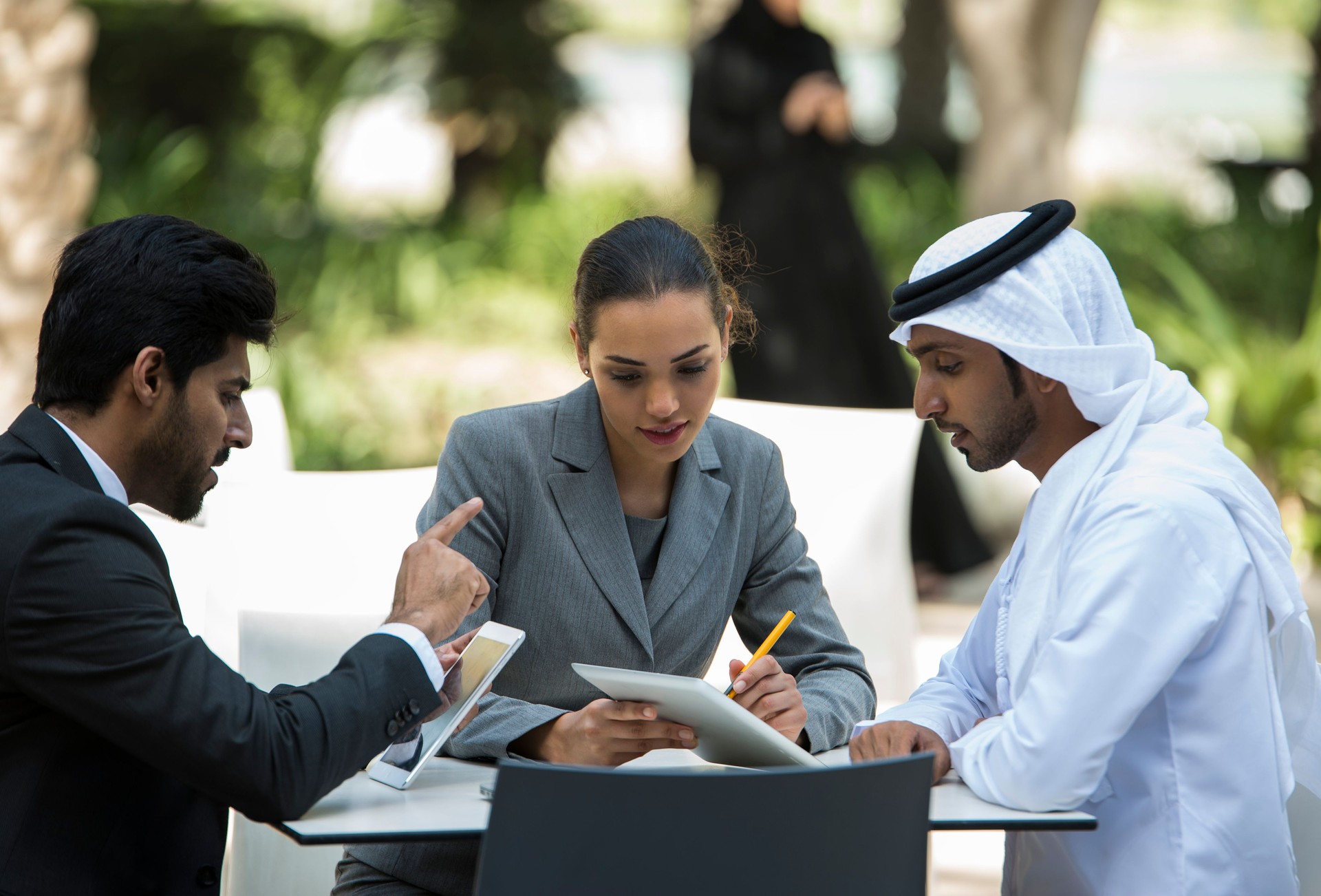 Discussion among Arabic business men and woman.